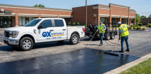 Professional sealcoating application on Indianapolis commercial parking lot
